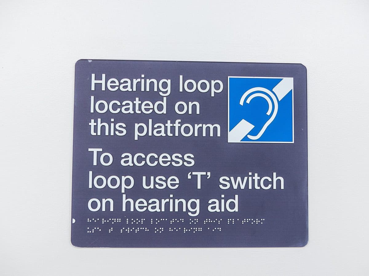 Hearing loop sign telling hearing-aid users to switch to the T setting