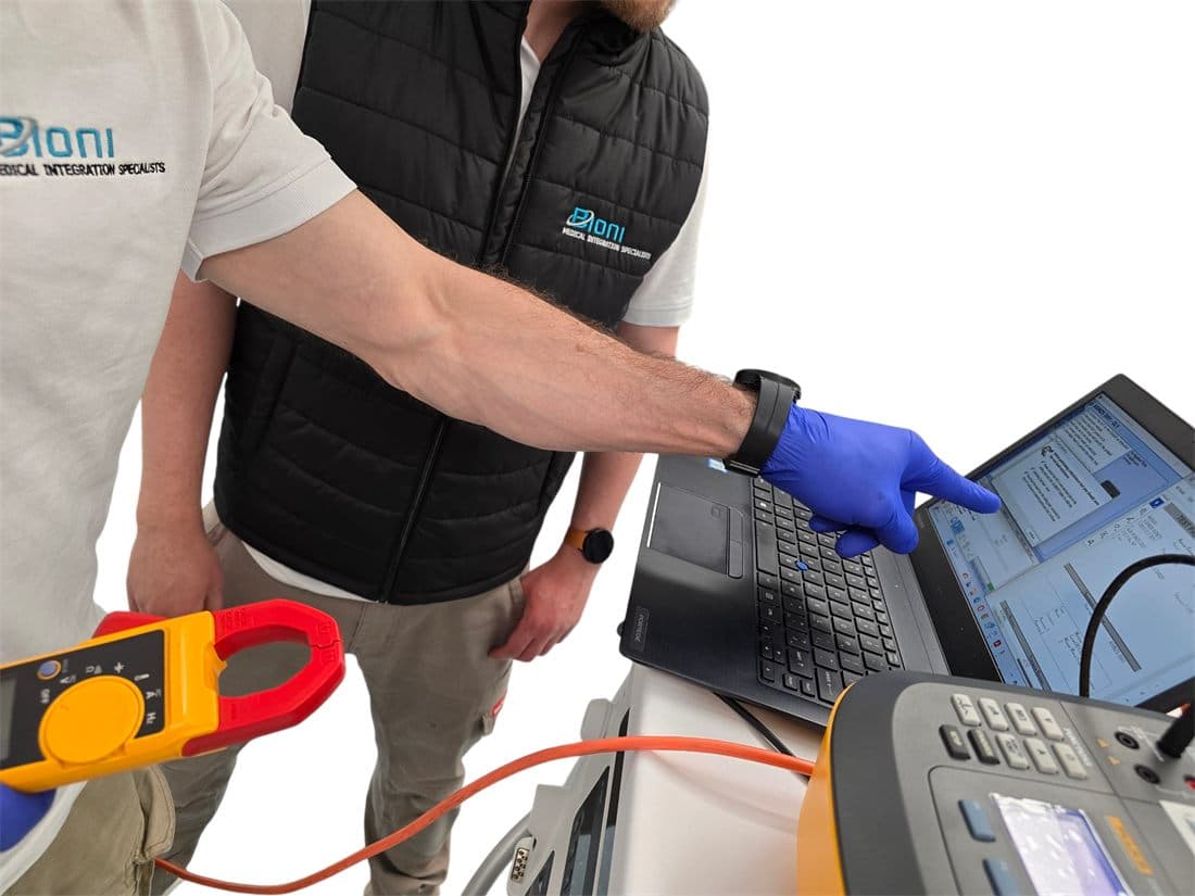 Technician carrying out electrical testing with a clamp meter and appliance tester