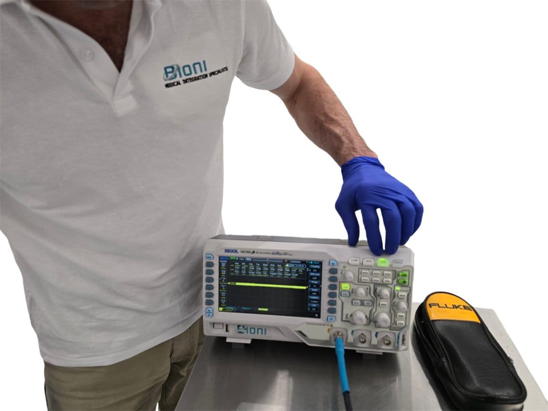 Bench testing electrical equipment with an oscilloscope and Fluke meter